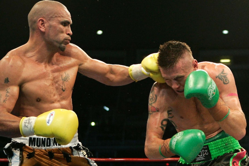 Anthony Mundine lands a punch against Danny Green during their non-title super middle weight bout in Sydney May 17, 2006.