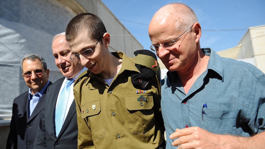 Freed Israeli soldier Gilad Shalit walks with his father Naom Shalit. (Getty Images/Israeli Defence Force)