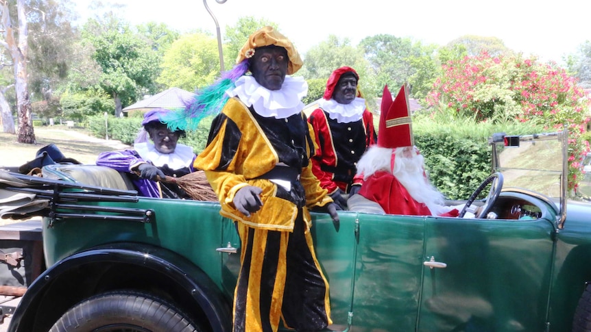 Three men wore traditional Black Pete dress at the Dutch Embassy.