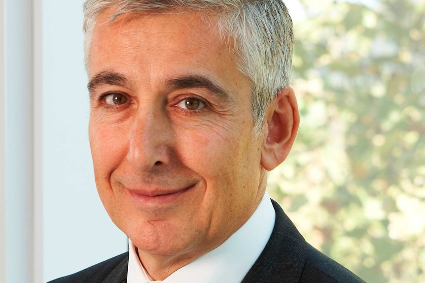 Head shot of National Association for Medical Deputising Services president Spiro Doukakis wearing a suit.