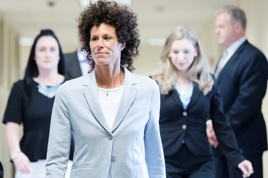 Andrea Constand walks to the courtroom during Bill Cosby's sexual assault trial.
