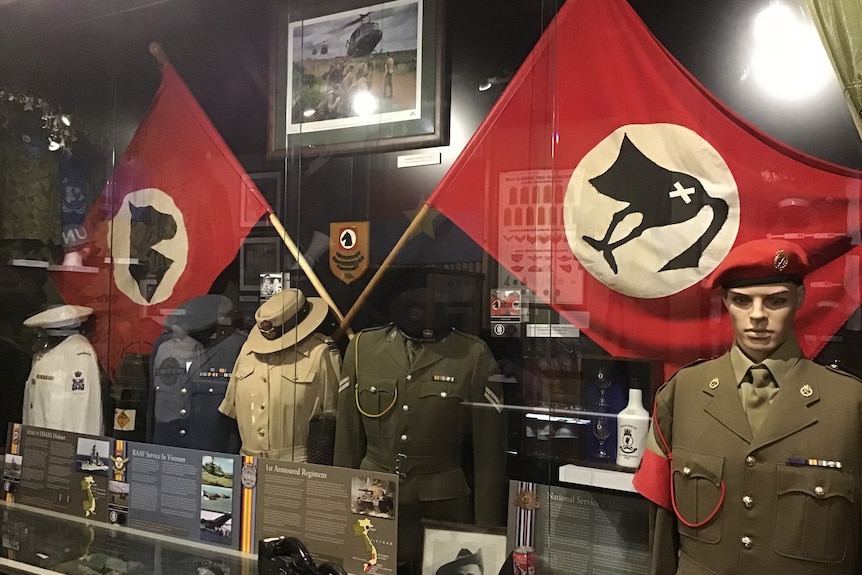 wartime flags and uniforms on display