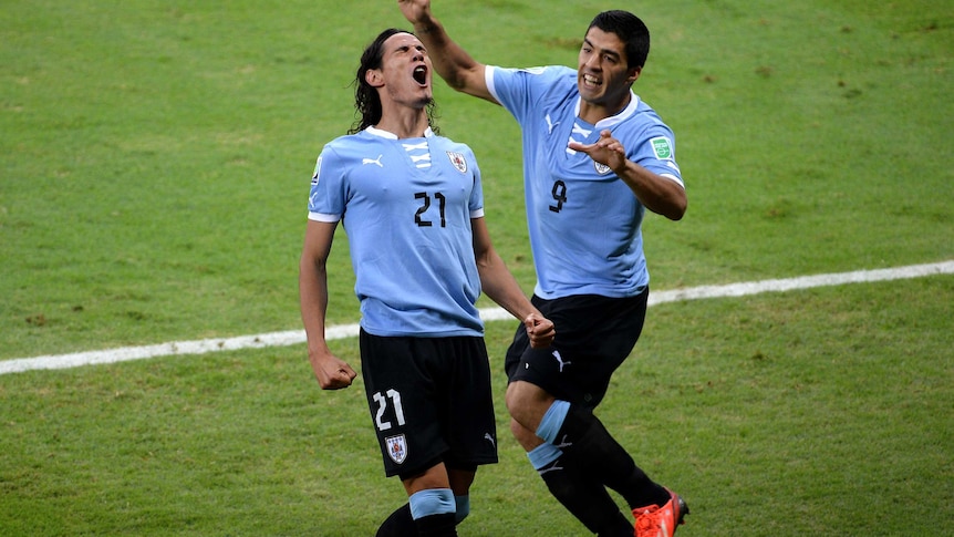 Uruguay's Edison Cavani (L) and Luis Suarez celebrate at the FIFA Confederations Cup in 2013.