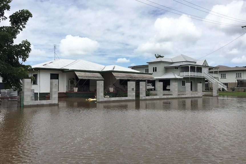 Flooded street and houses in Ingham in north Queensland.