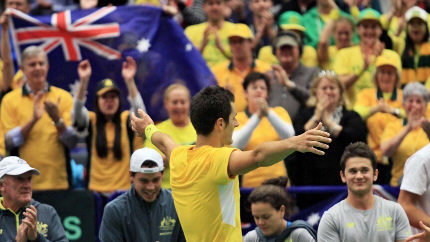 Australia's Bernard Tomic celebrates after his win in the Davis Cup tie against Czech Republic.