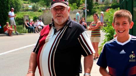 Locals show their support as the Tour de France passes through the town of Malaucene