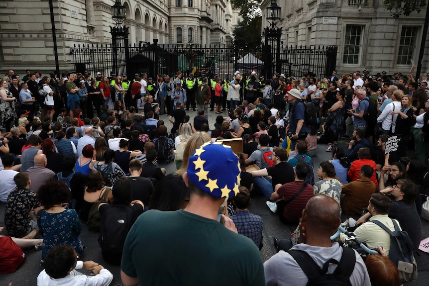 Anti-Brexit supporters gather outside the Prime Minister's residence 10 Downing Street in London.