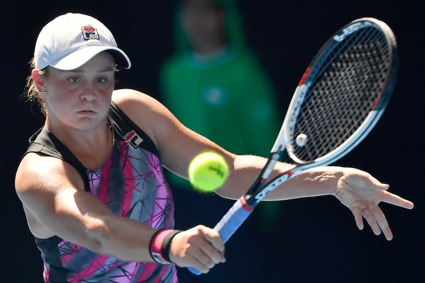 Australia's Ashleigh Barty hits a return to Germany's Annika Beck in Australian Open first round.