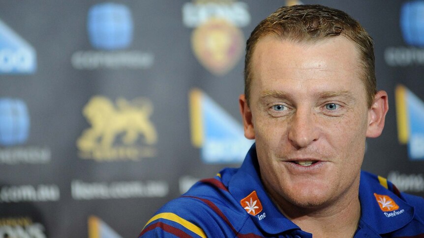 Michael Voss talks to the media as Brisbane Lions coach in August 2011.