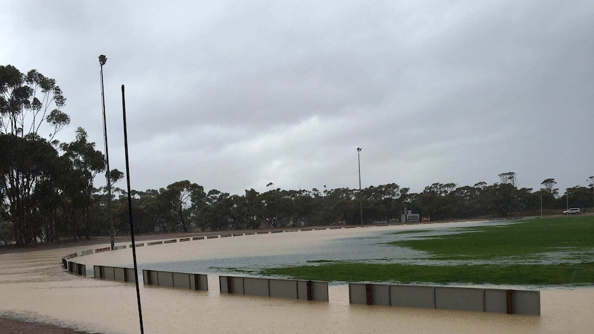 Wide shot of Gnowangerup football oval inundated with water after heavy rain.
