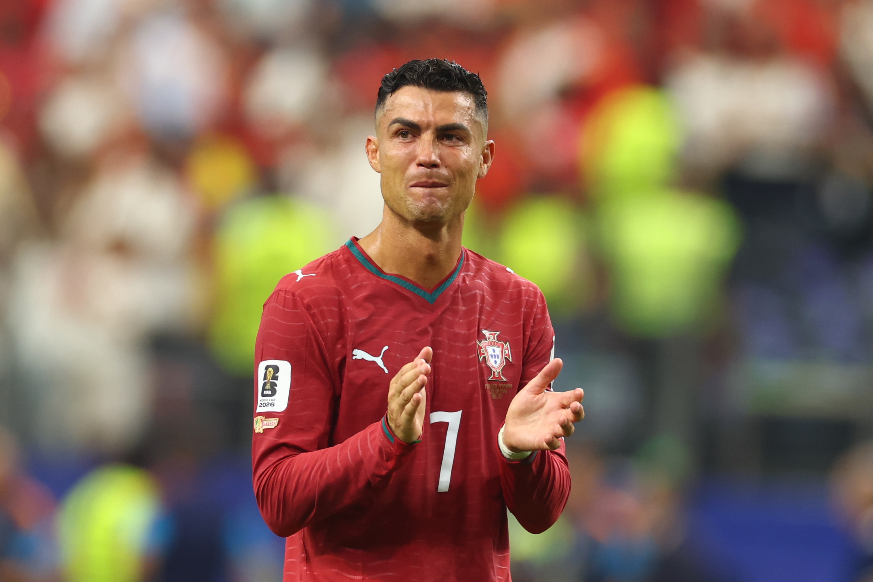 Cristiano Ronaldo crying on the field after a Portugal game