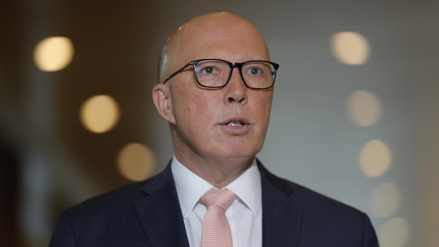 A close up shot of Peter Dutton in glasses.