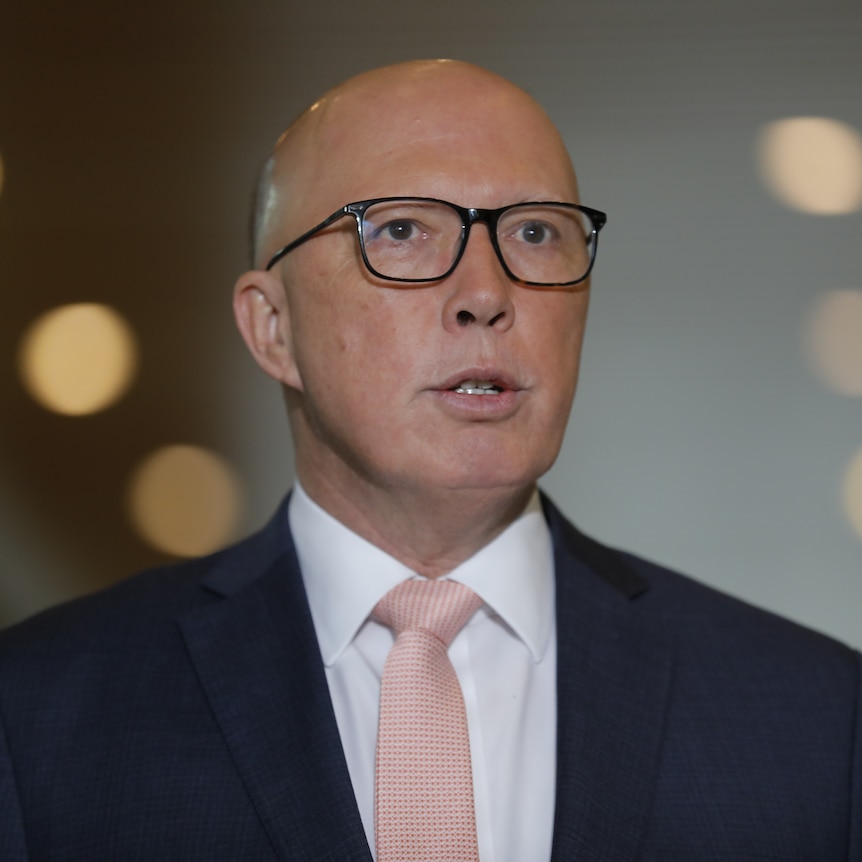 A close up shot of Peter Dutton in glasses.