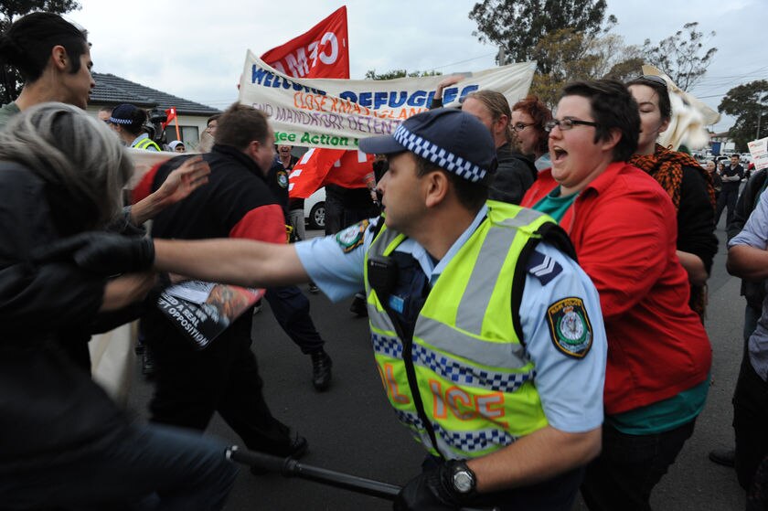 Police move in on rooftop protest - ABC News