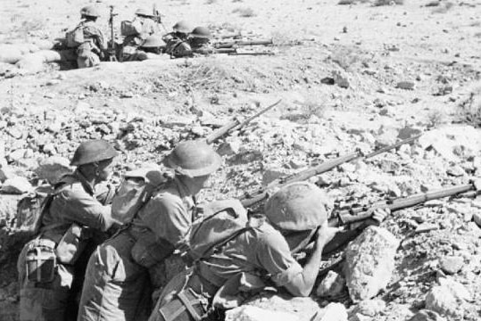 Old photo of soldiers holding guns in bunker