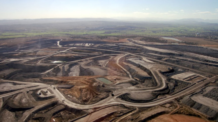 An aerial view of dirt roads and open mines