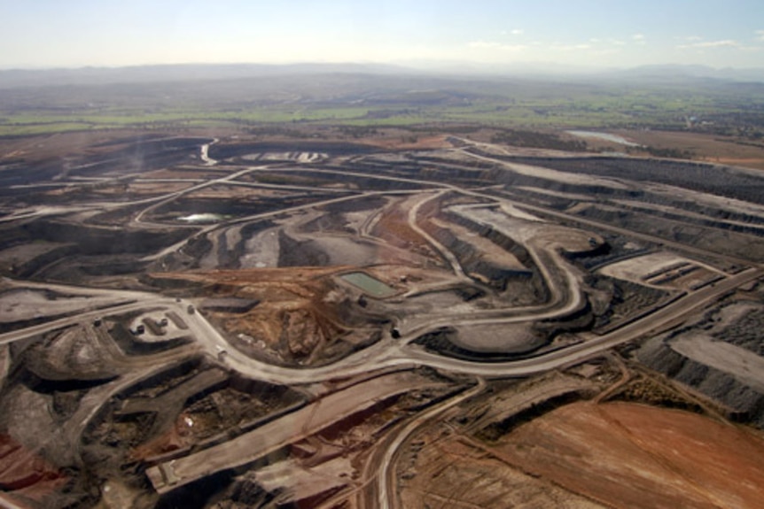 An aerial view of dirt roads and open mines