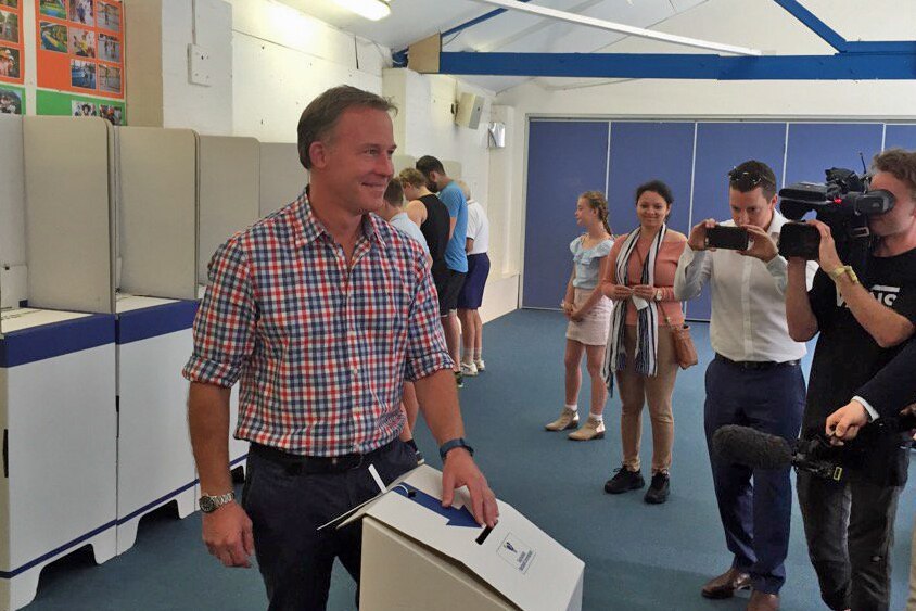 Liberal Leader Will Hodgman casts his vote