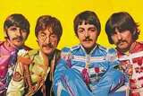 Sgt Pepper gatefold sleeve showing the four Beatles in front of a yellow background