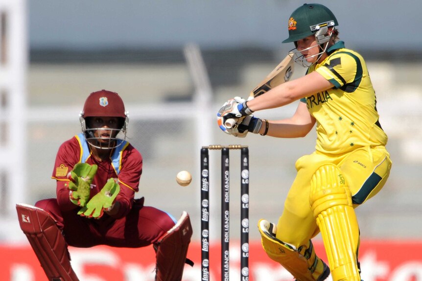 Australia's Jess Cameron plays a shot as West Indies wicketkeeper Merissa Aguilleria looks on.
