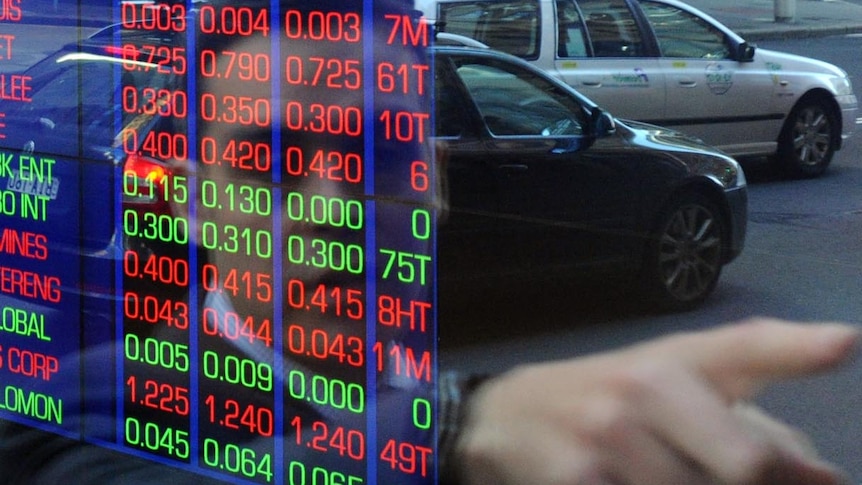 Investors watch the ASX board