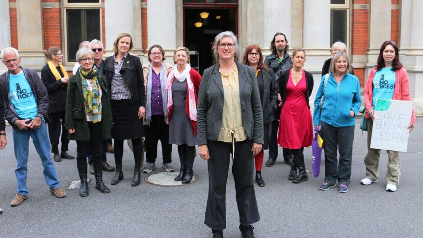 A group of people standing outside the Supreme Court in Perth.