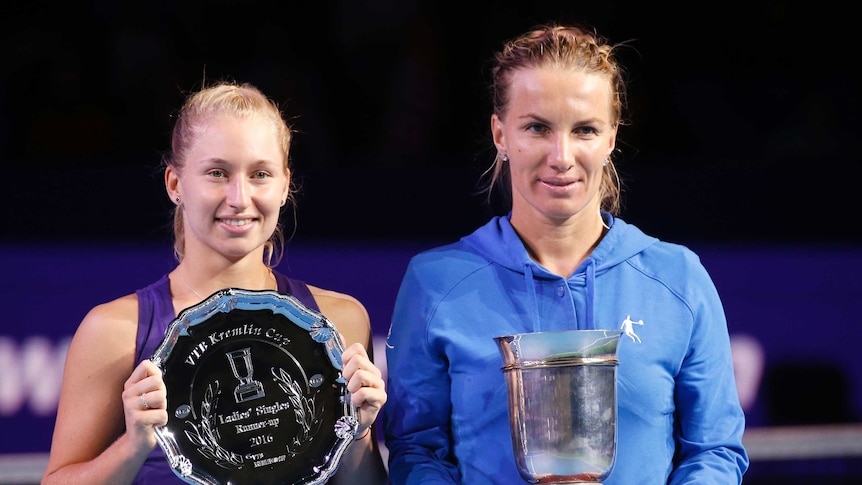 Australia's Daria Gavrilova (L) and Russia's Svetlana Kuznetsova after the Kremlin Cup final.