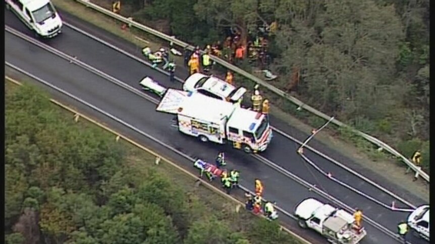 Crews attend the bus crash on the Great Ocean Road.