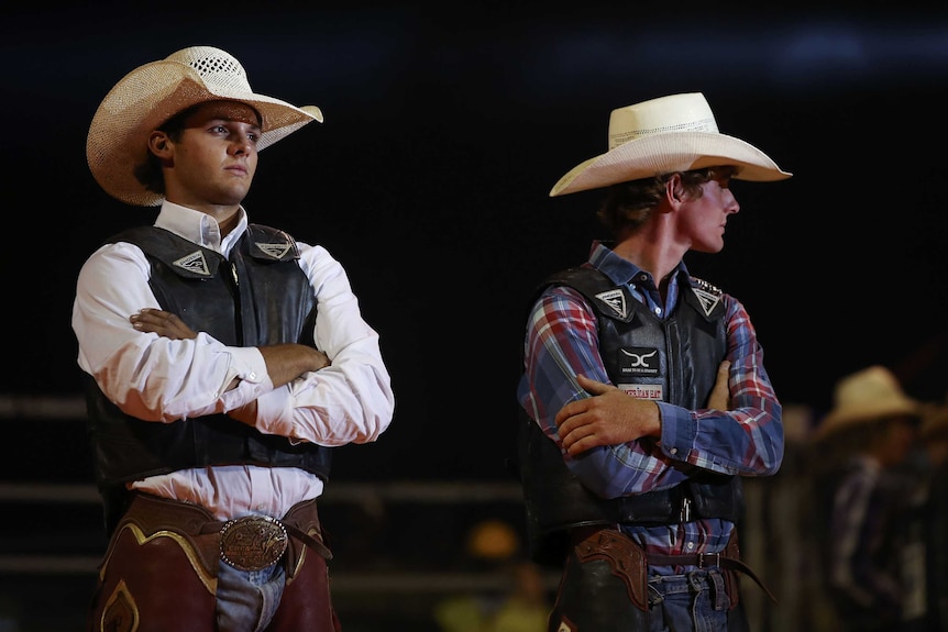 Bull riders during the rider introductions before the PBR event