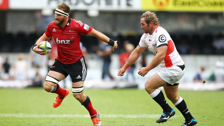 Kieran Read runs with the ball for the Crusaders against the Sharks in Durban.