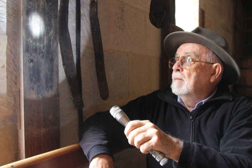 Dr Ian Evans inspects ritual burn marks at a stable.