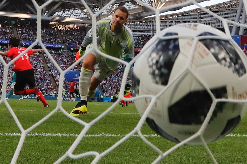 Germany goalkeeper Manuel Neuer watches ball in the net against South Korea