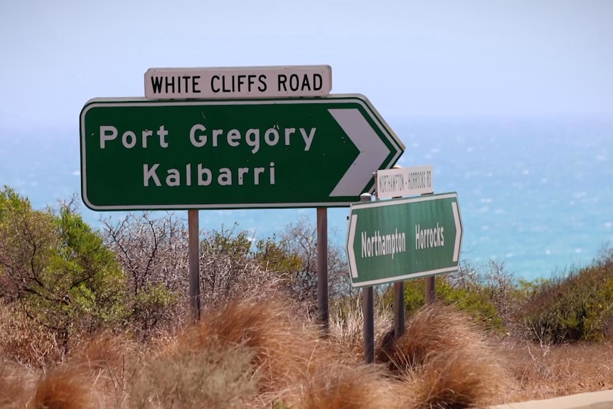 A road sign pointing to the towns of Port Gregory and Kalbarri