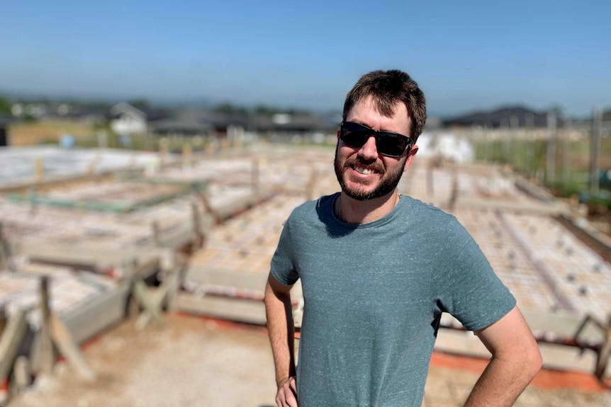 a man infront of a building site