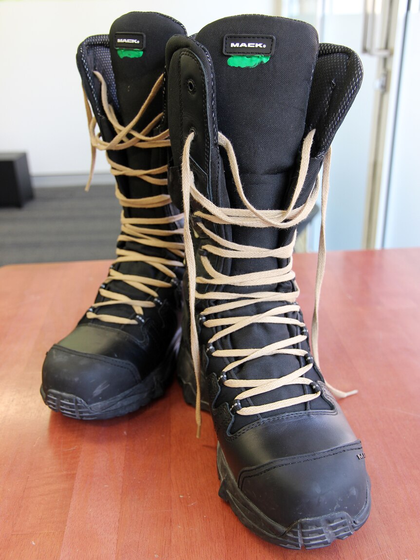 Jess Dobson's new mining boots on a table.