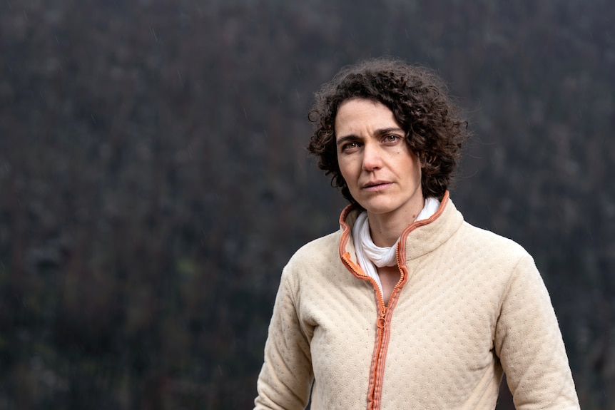 Marta Yebra standing in front of a forest.