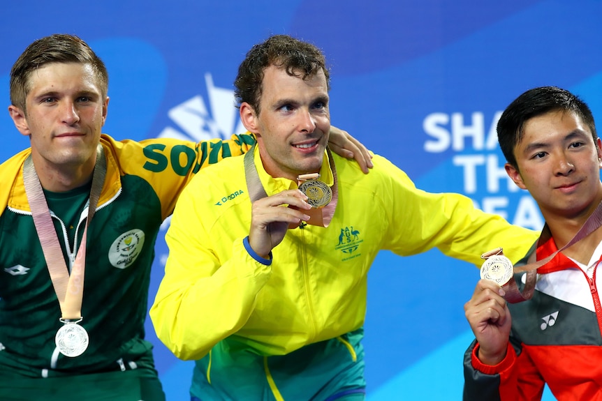 Matthew Levy poses for a photo with his gold medal.