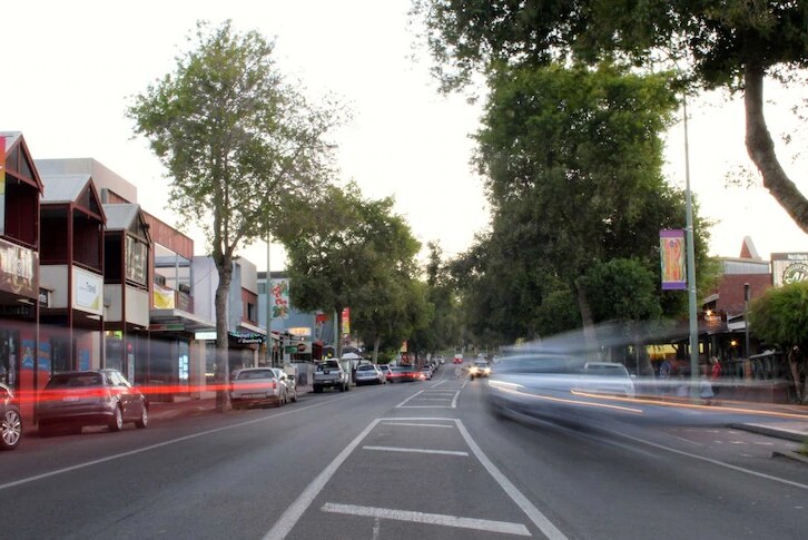 the main street in Margaret River with parked cars lined on either side of the street