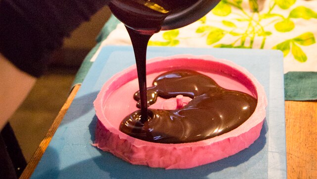 Julia Drouhin pours the chocolate in to the mould before setting at room temperature and freezing it for 24 hours.