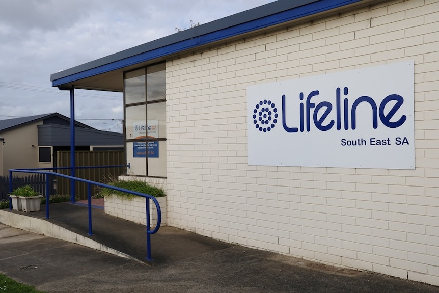 A white brick building with a white and blue sign that reads "Lifeline South East SA"