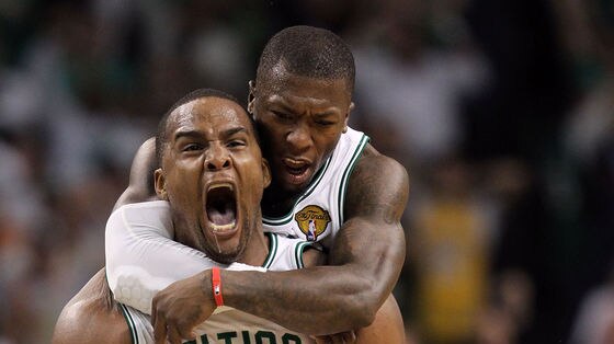 Carrying the team: Glen Davis (front) and Nate Robinson sparked the Celtics in the fourth.