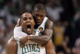 Carrying the team: Glen Davis (front) and Nate Robinson sparked the Celtics in the fourth.