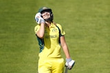 Ellyse Perry looking to the sky with a frustrated look on her face.