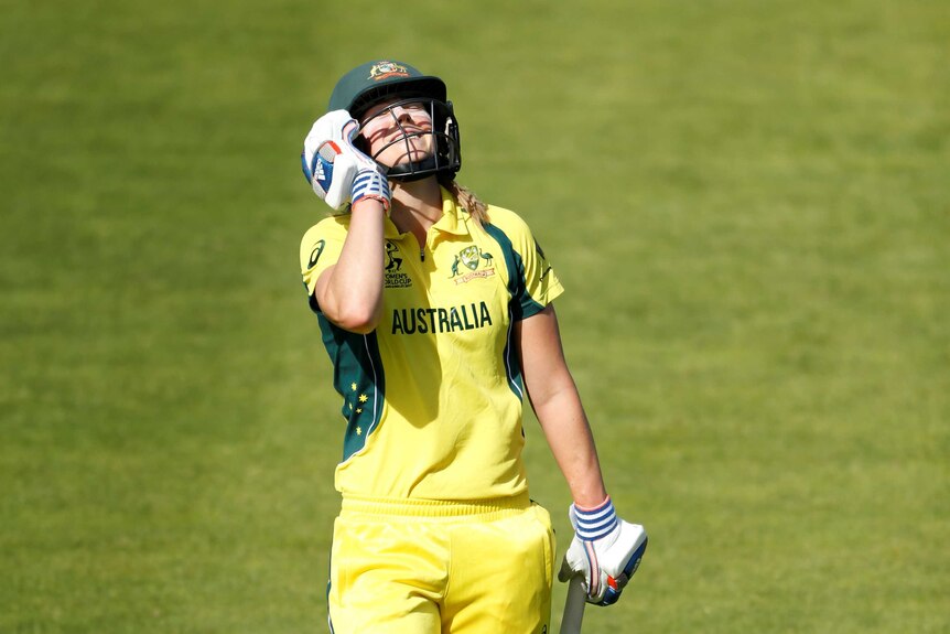 Ellyse Perry looking to the sky with a frustrated look on her face.