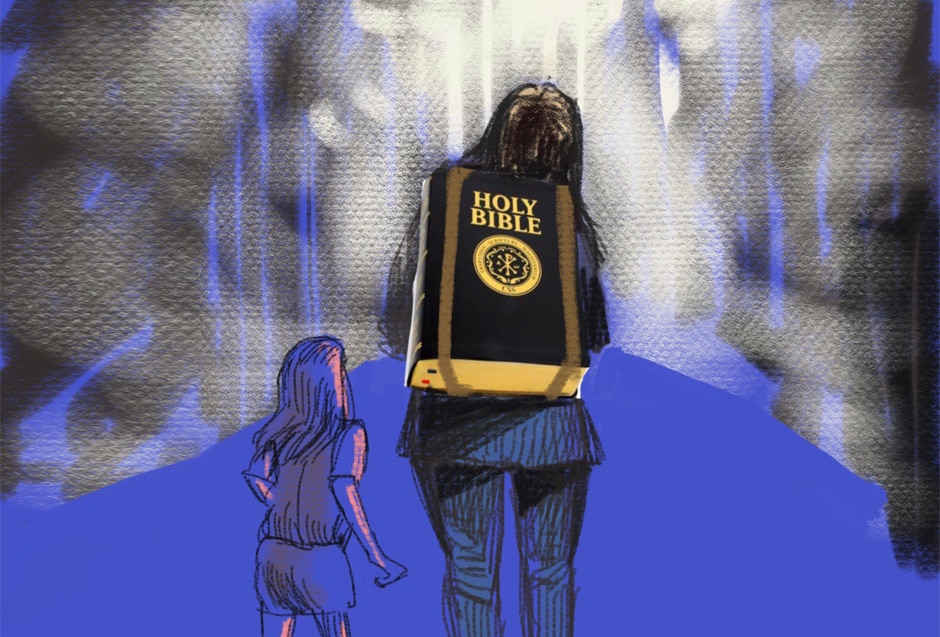 A woman carries a bible on her back as her daughter walks beside her.