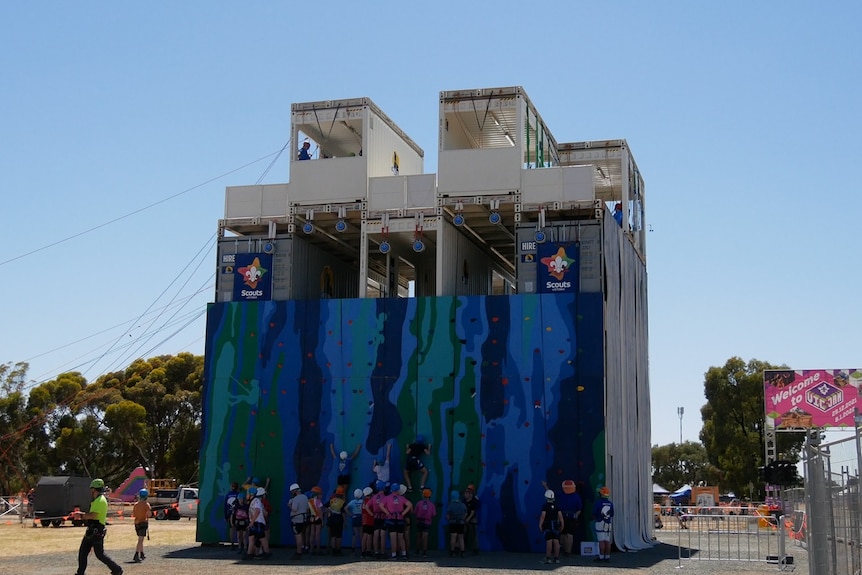 a big rock climbing and abseiling set up made from shipping contrainers