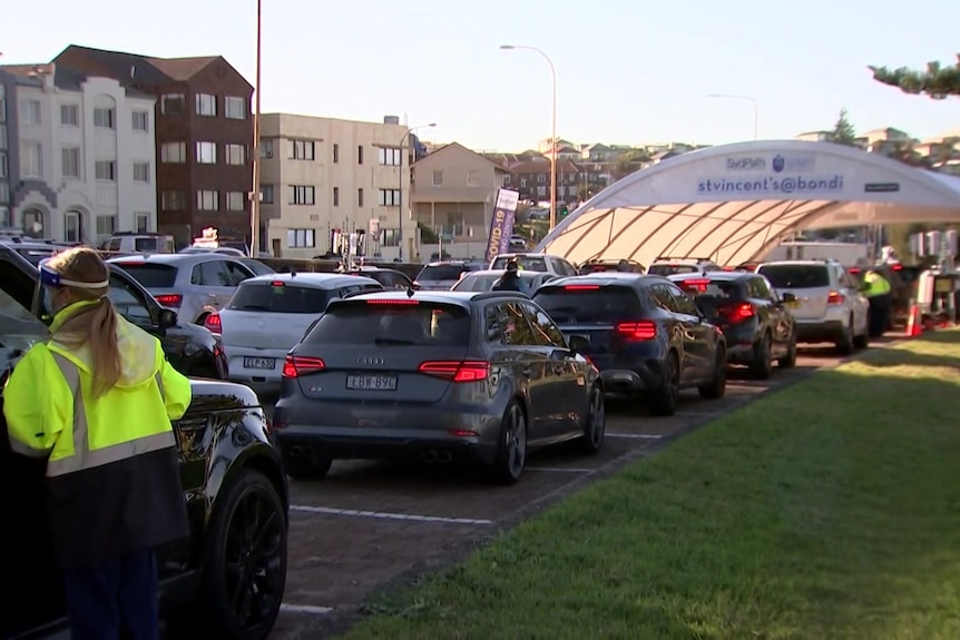 A row of cars outside a coronavirus testing clinic 