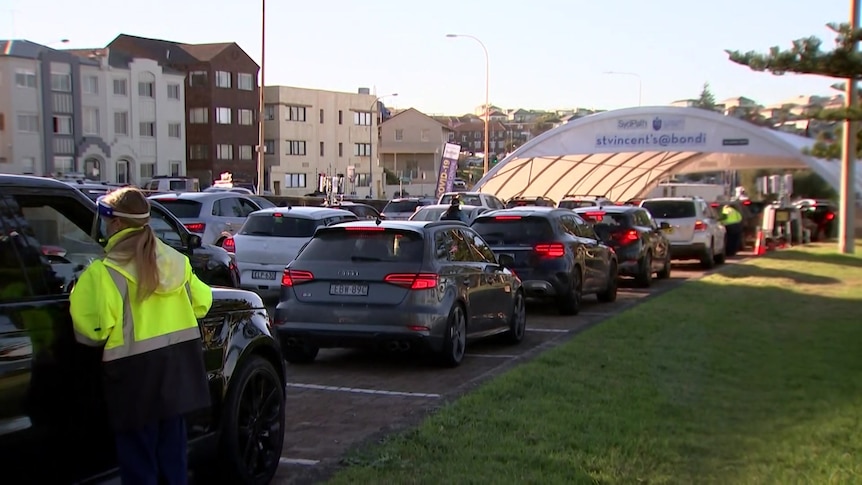 A row of cars outside a coronavirus testing clinic 