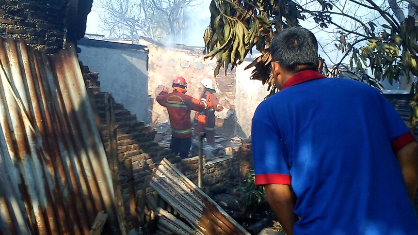 Emergency personnel search Jakarta crash site