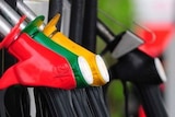 Red, green and yellow petrol pumps